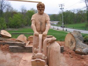 One of the carved woodmen outside Williams facility